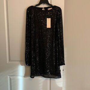 Here is a long sleeve black sequined dress with a wrap around belt size 20